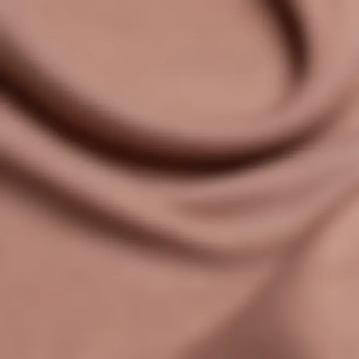 Close-up of fabric texture highlighting softness and stretch of a scoop neck top