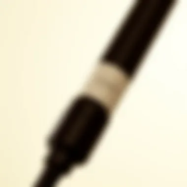 Close-up of a curling wand with European plug