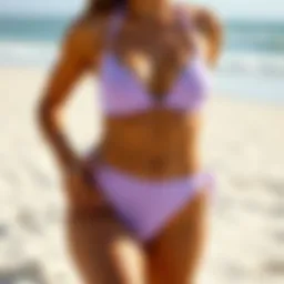 A stylish light purple high waisted bikini on a sandy beach