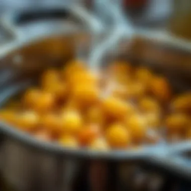 A close-up of wax beans melting in a pot, demonstrating their transformation