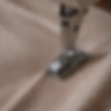 Close-up of a clip securing a hem on fabric