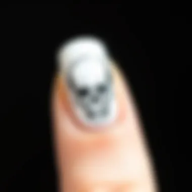 Close-up of a beautifully applied skull nail sticker on a polished nail