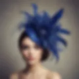 A stunning royal blue fascinator adorned with intricate feather details.